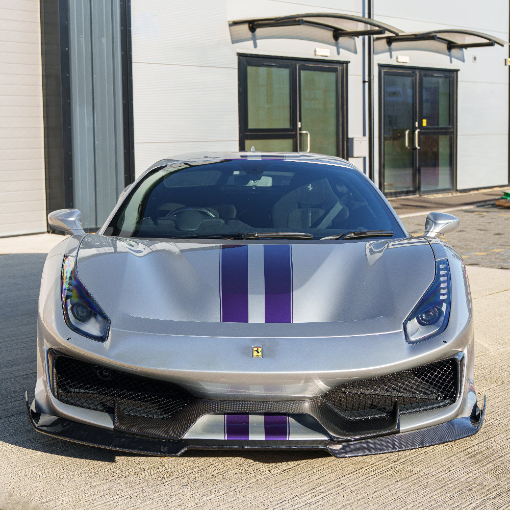 Ferrari 488 Pista carbon fibre splitter by CT Carbon, showcasing its sleek aerodynamic design and textured finish.
