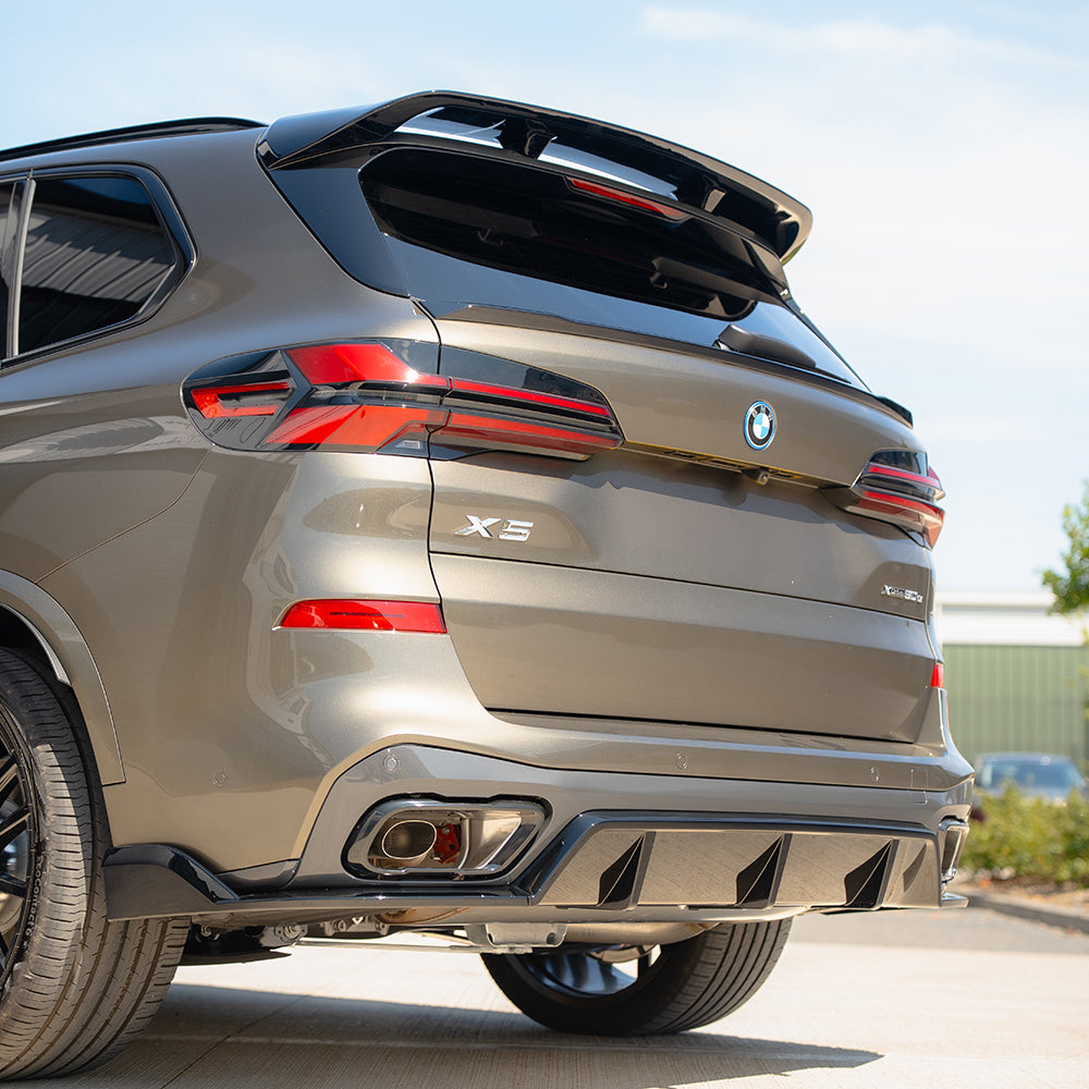 BMW G05 X5 LCI full gloss black kit by CT Carbon, showing detailed close-up of the sleek black exterior components.