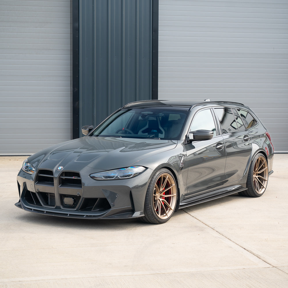 BMW M3/M4 G80/G81/G82/G83 carbon fibre grille by CT Carbon with ACC V1, showing close-up of sleek black grille design.