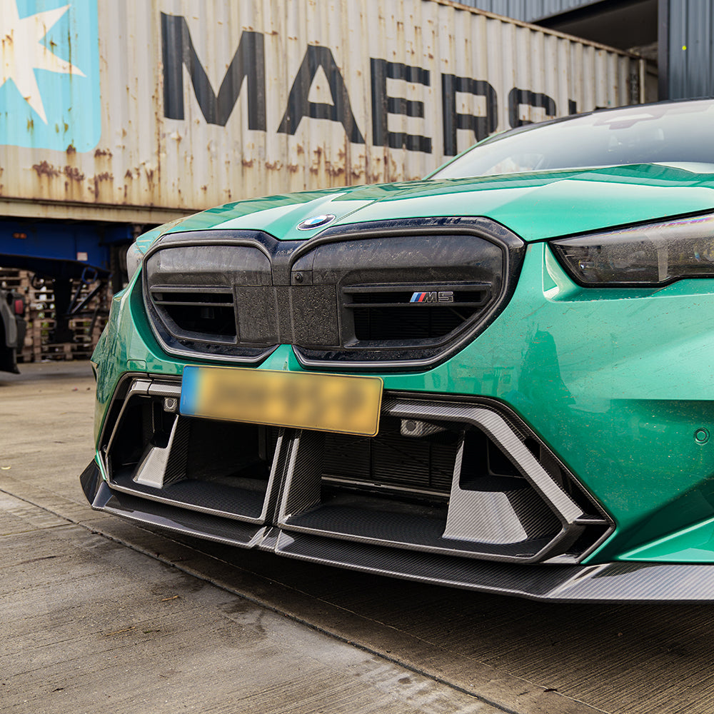 BMW G90 G99 M5 2024 carbon fibre front bumper middle trim by CT Carbon, showing the sleek, green bumper detail.