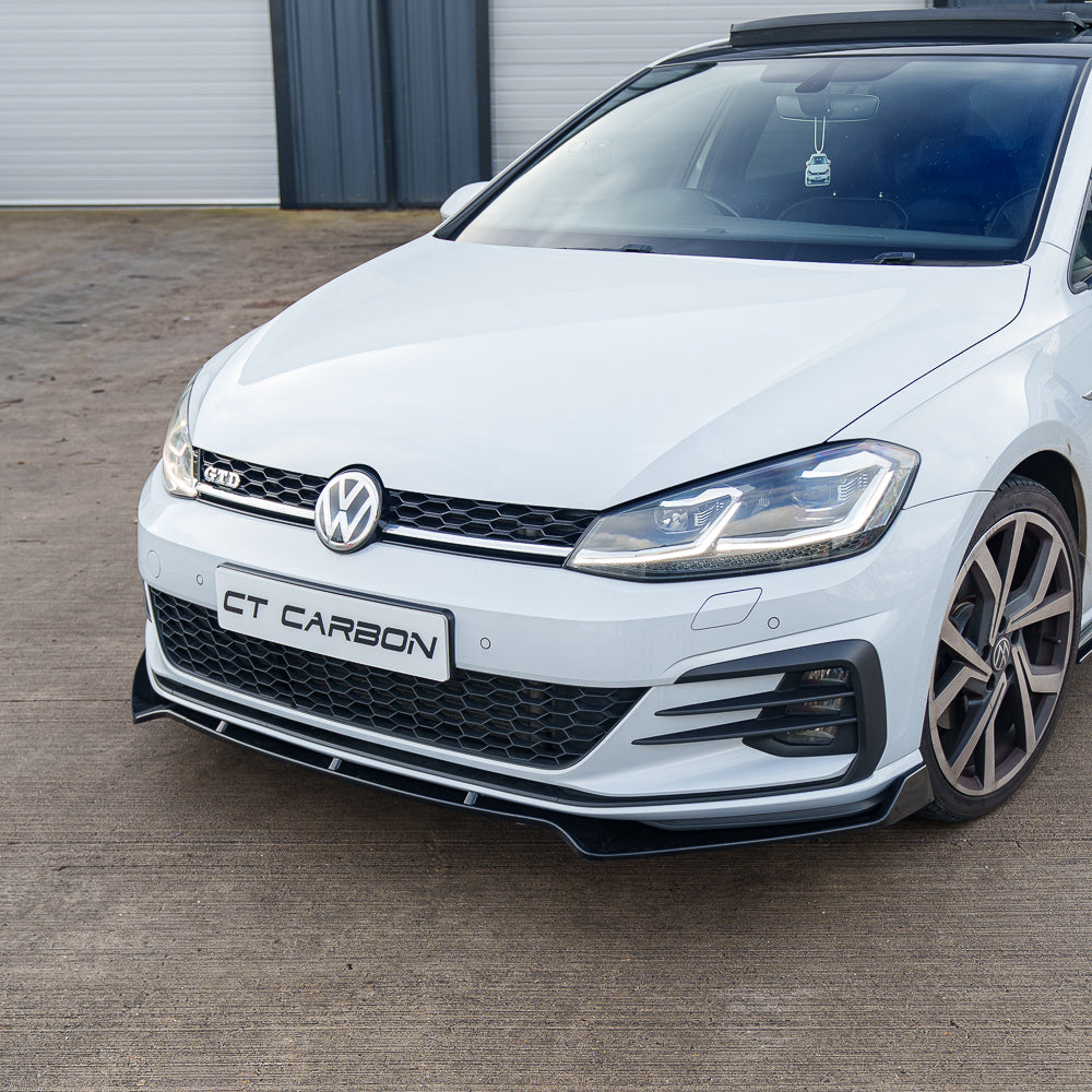Gloss black splitter for Volkswagen Golf MK7/7.5 GTI, R, GTD by CT Carbon, mounted on front bumper for sporty look.