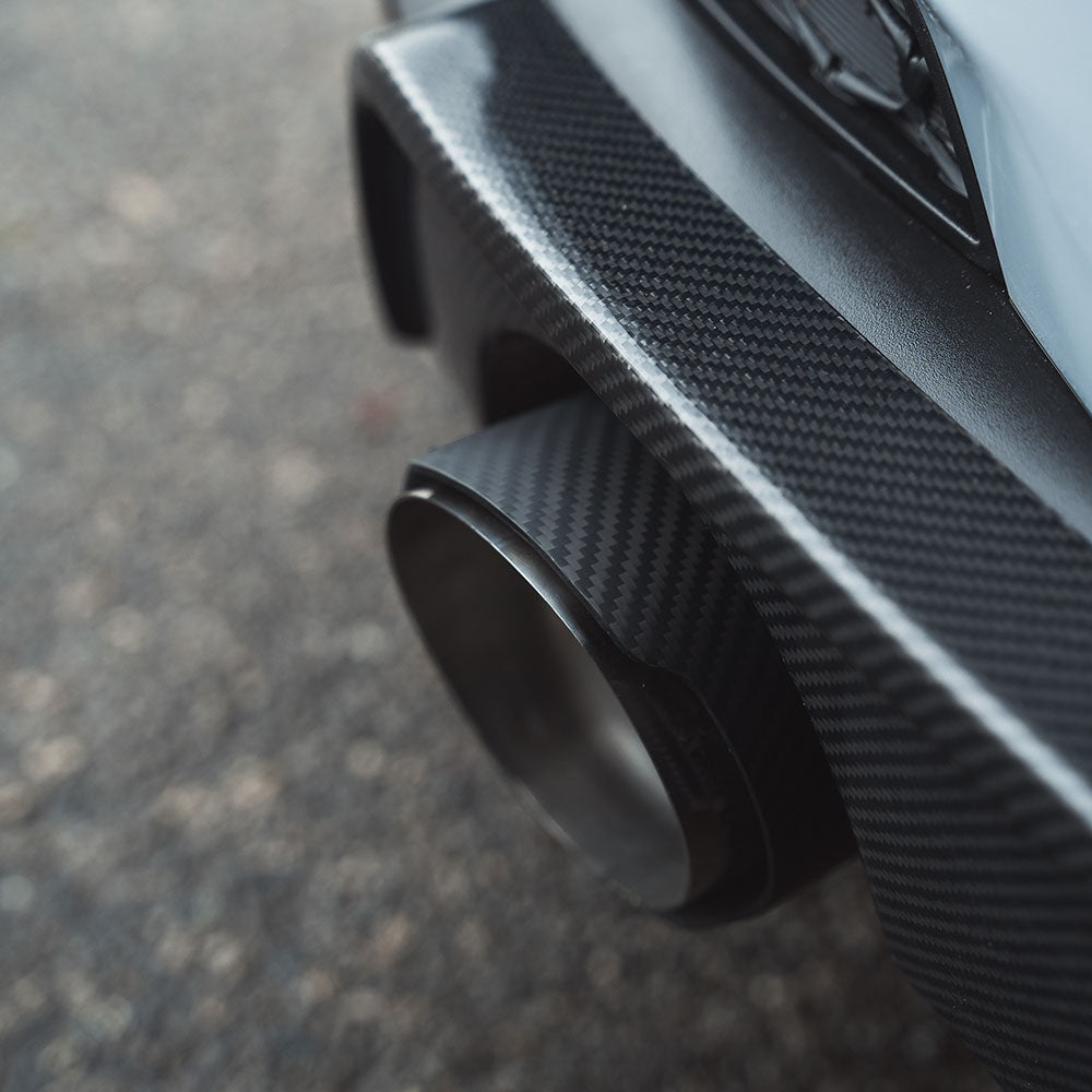 Hyundai I30N carbon fiber exhaust tips by CT Carbon, showcasing sleek, lightweight exhaust accessory with a modern finish.