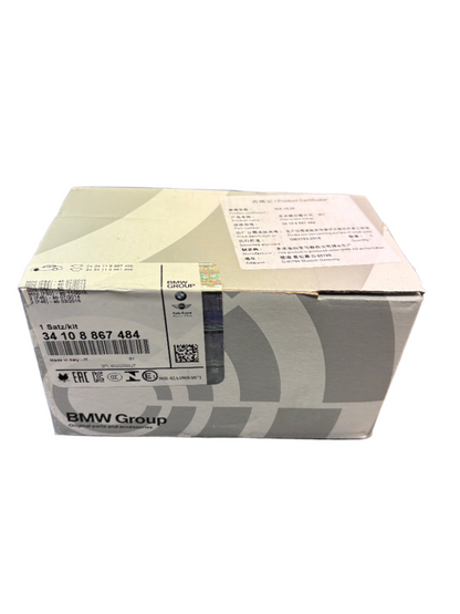 Genuine BMW MINI front brake pads, model 34108867484, showing the brake pad set with metallic backing plates and friction material.