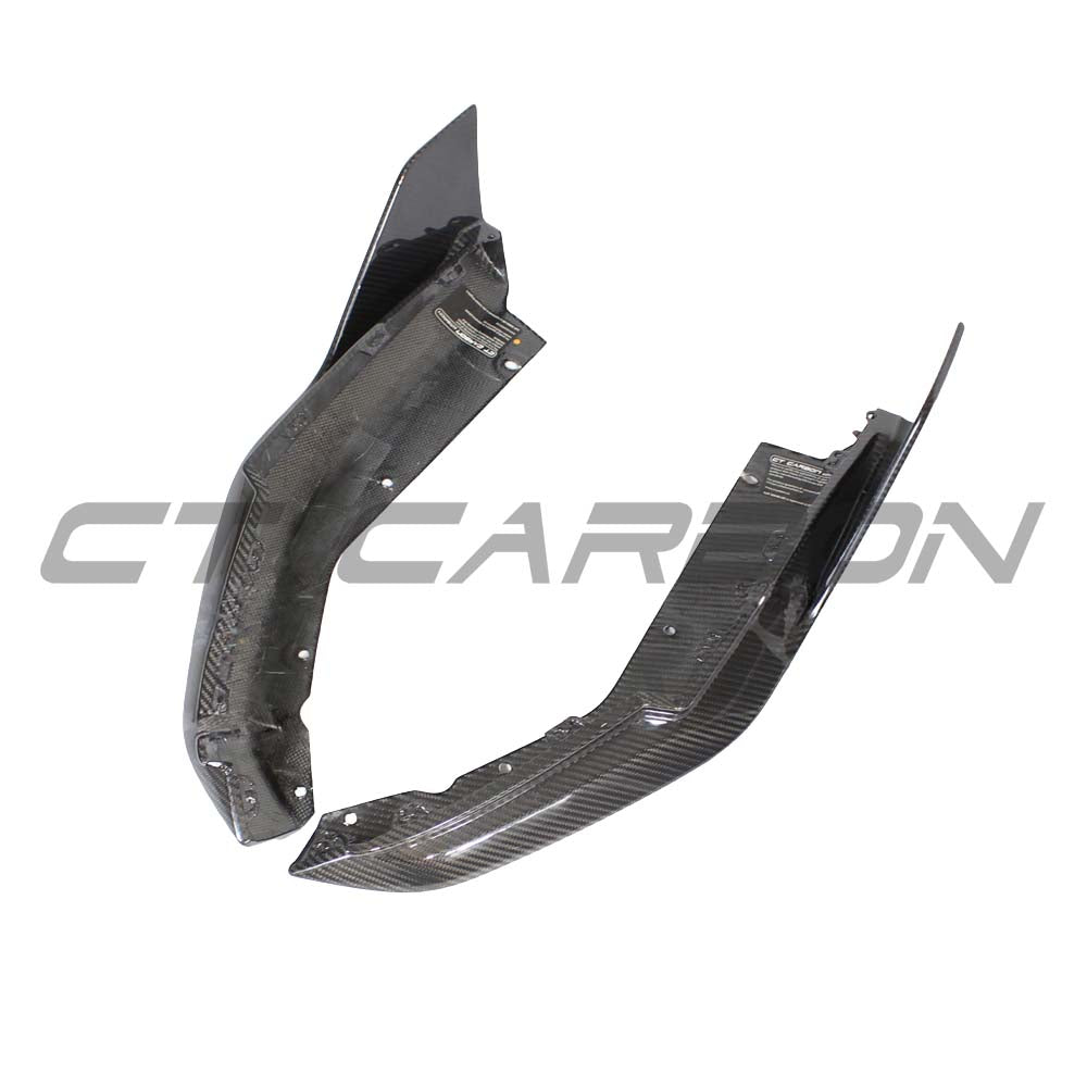BMW G82 M4 full carbon fiber kit by CT Carbon, showing detailed carbon fiber components on the car's exterior.