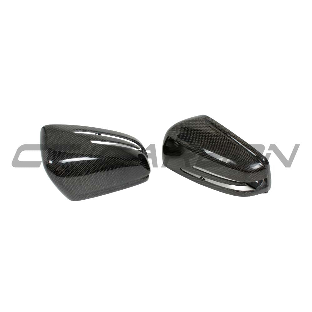 Carbon fibre side mirrors for Mercedes C and E Class W204 and W212 by CT Carbon, showing sleek, aerodynamic mirror covers.