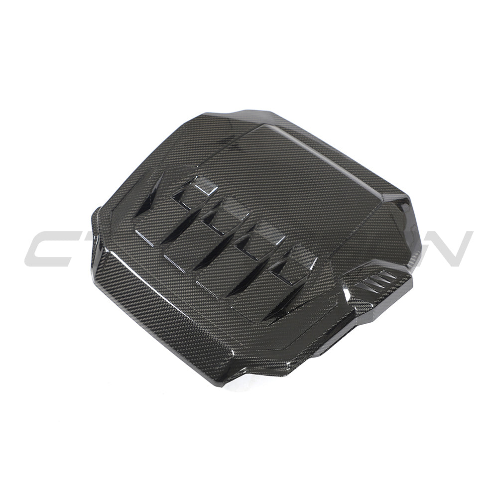 Carbon fiber engine cover for VW Golf MK8 GTI, 2020+ model, by CT Carbon, showcasing sleek, textured design on engine bay.