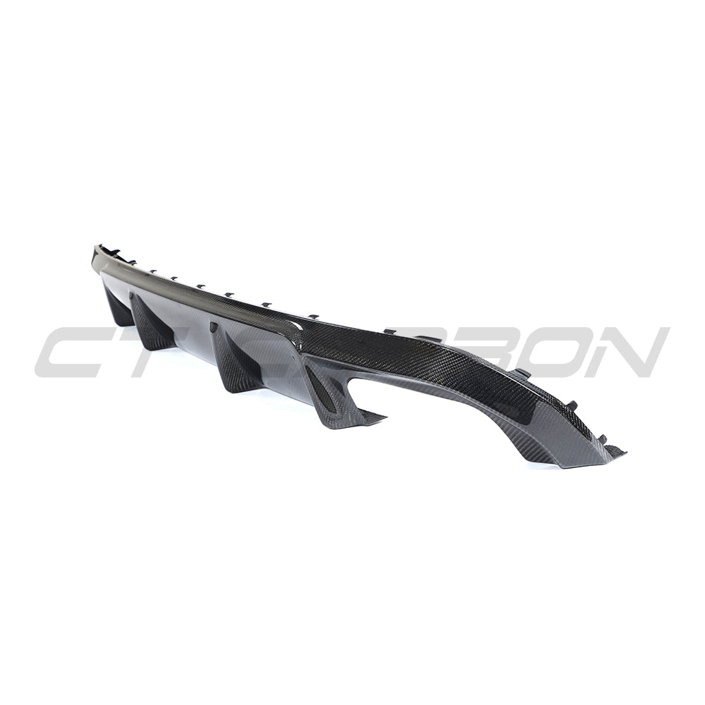 BMW G26 4 Series 2020+ carbon fiber diffuser by CT Carbon, showcasing sleek, textured carbon fiber surface and aerodynamic design.