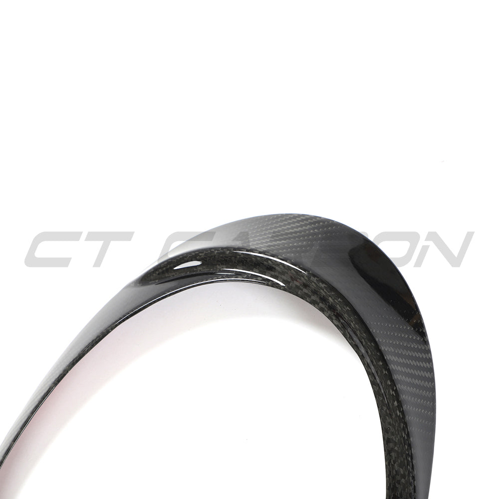 Carbon fiber headlight eyebrows for Porsche 991 911 (2012-2021) by CT Carbon, showcasing sleek, aerodynamic accessory details.