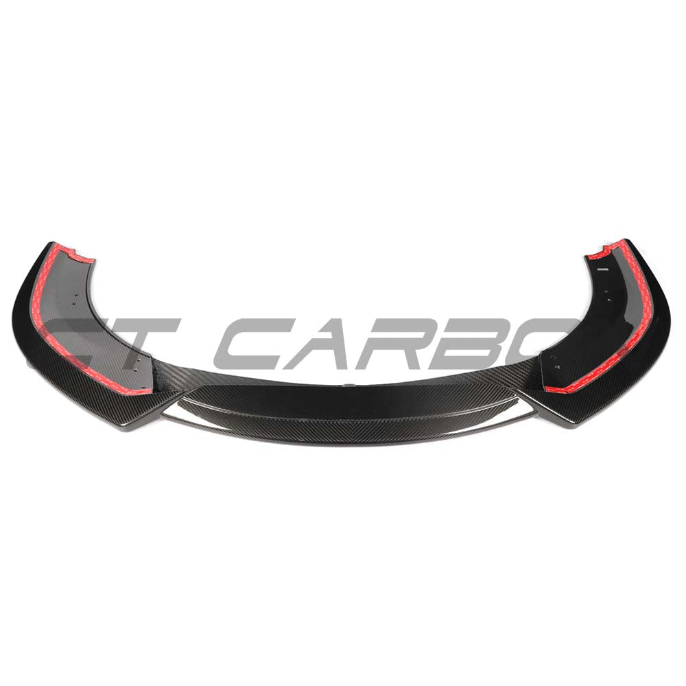CT Carbon McLaren 750S 2023 carbon fiber splitter installed on front of the sports car, showcasing sleek aerodynamic design.