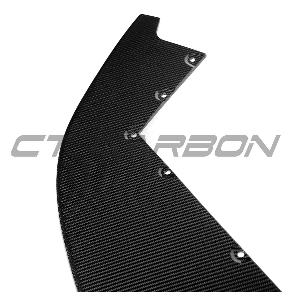 CT Carbon McLaren Artura 2023 carbon fibre splitter installed on a sports car, showcasing sleek aerodynamic design.