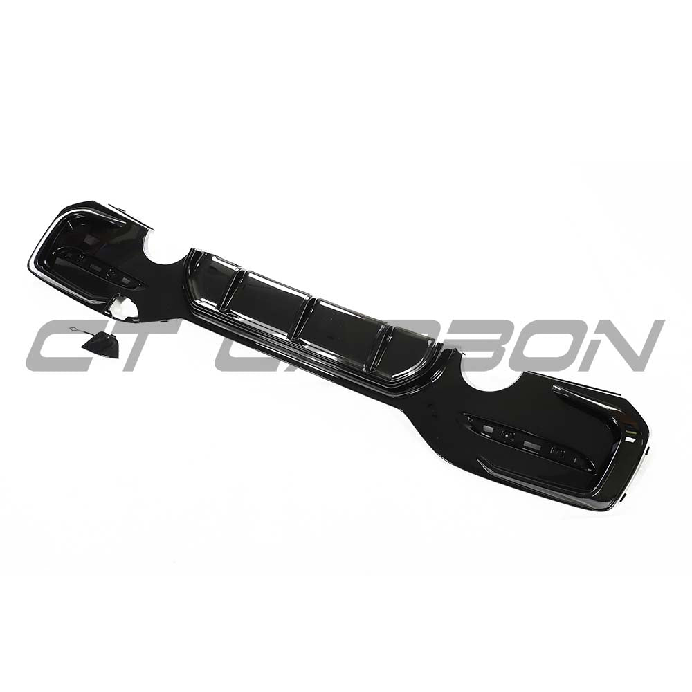 BMW F20/F21 1 Series LCI dual exit exhaust kit in gloss black by CT Carbon, shown with dual exhaust tips on a vehicle.