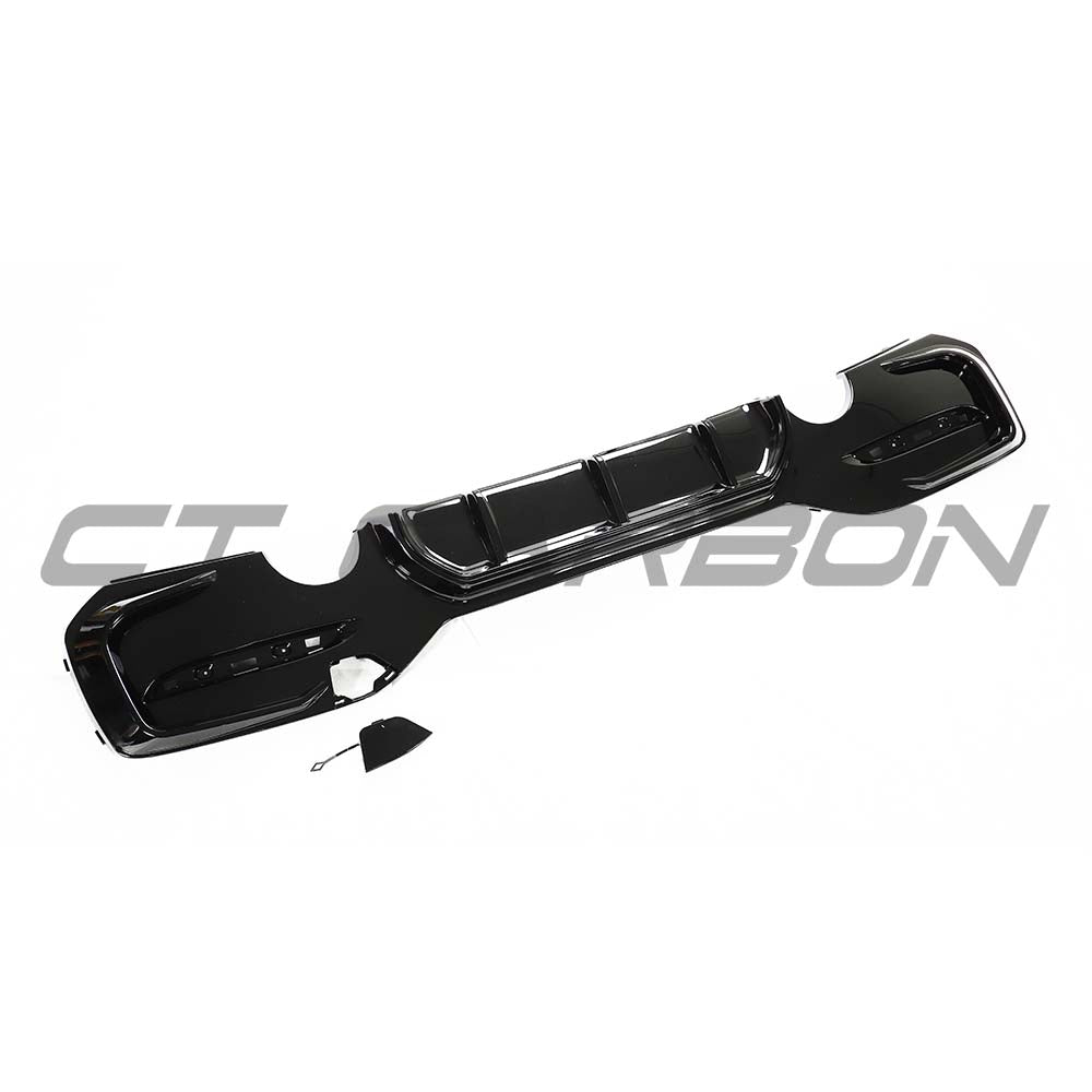 BMW F20/F21 1 Series LCI dual exit exhaust kit by CT Carbon in gloss black, shown with dual exhaust tips on a vehicle.