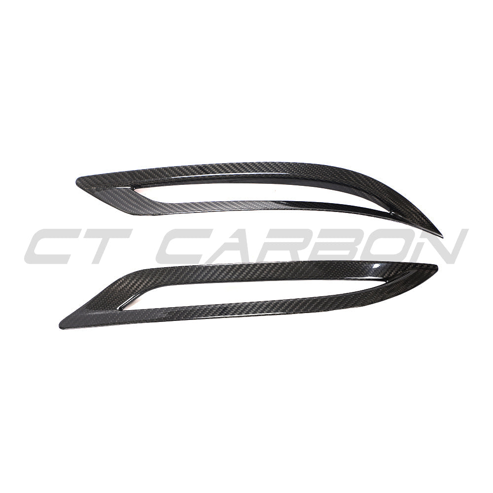 Carbon fibre rear reflector cover for Tesla Model 3 (2017-2023) by CT Carbon, shown on a white vehicle.