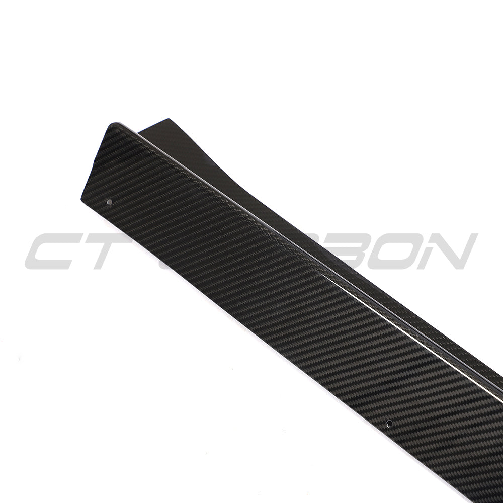 BMW 8 Series M8 G16/F93 carbon fibre side skirts by CT Carbon, showcasing sleek, aerodynamic design on a modern car.