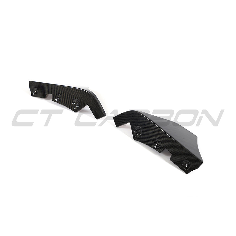 Toyota Supra 2019+ A90 carbon fiber rear bumper corners by CT Carbon, close-up view showing sleek, textured black carbon fiber details.