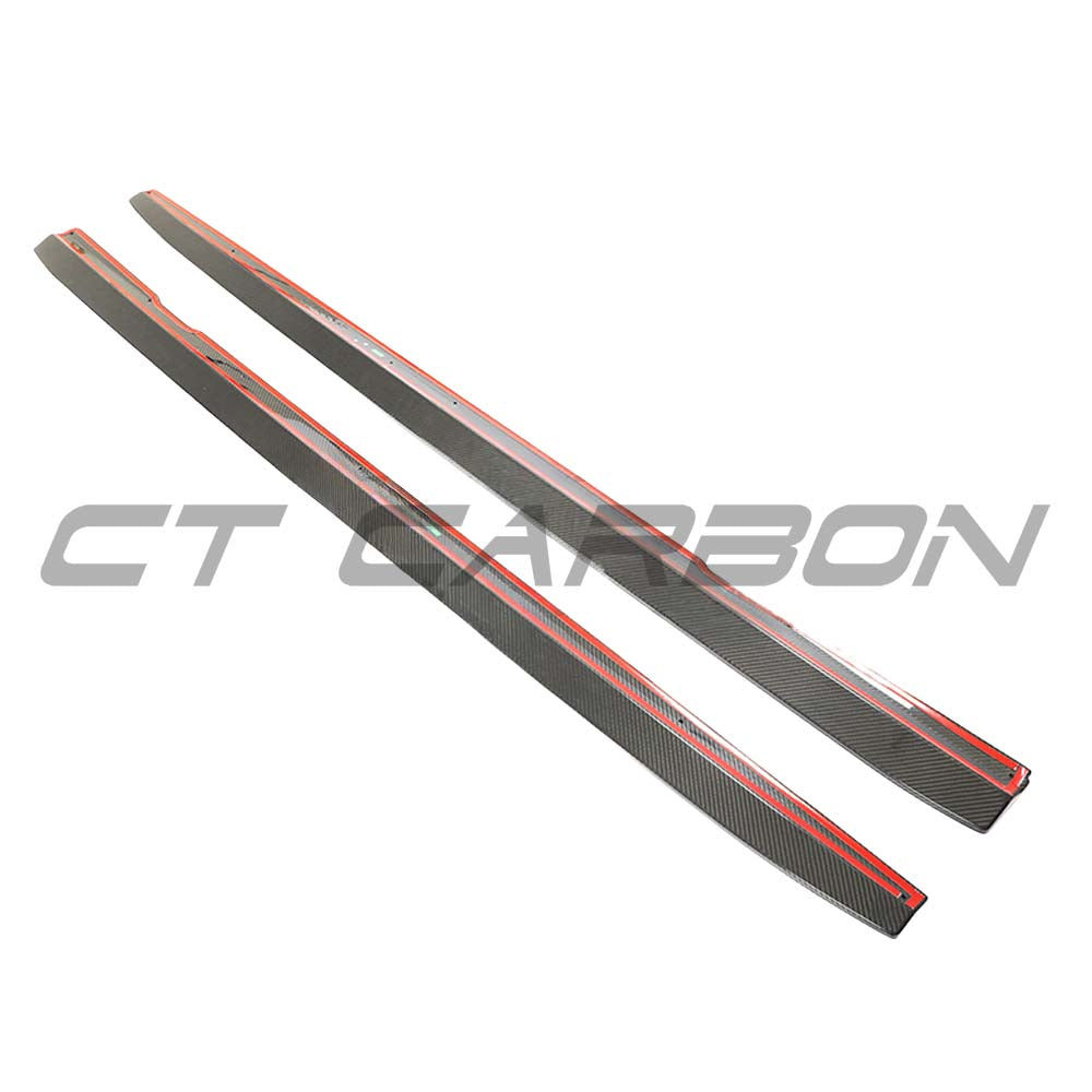 Mercedes E63 W213 2018-2020 pre-facelift carbon fibre side skirts by CT Carbon, showing sleek, textured aerodynamic design.