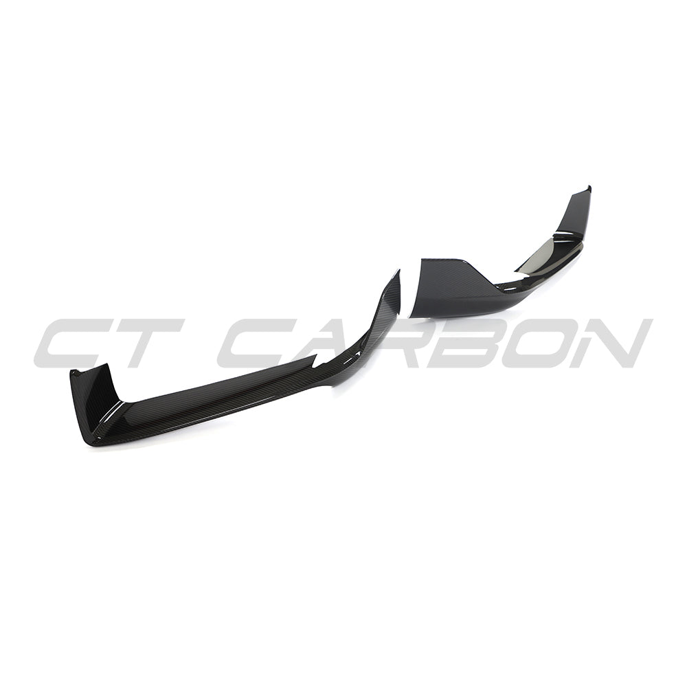 CT Carbon Porsche 992 Carrera 2018-2024 carbon fibre corner splitters mounted on the front of the sports car.