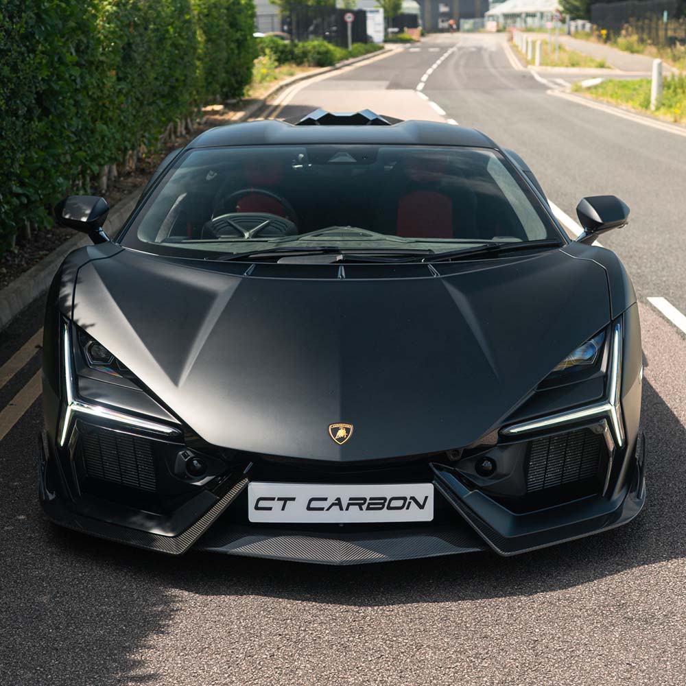 Lamborghini Revueltto carbon fiber front splitter by CT Carbon, showcasing sleek aerodynamic design and high-quality construction.