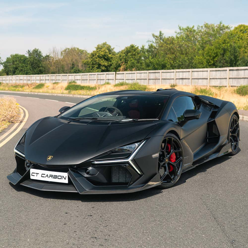 Lamborghini Revueltto carbon fiber side skirts by CT Carbon, close-up view showing sleek, aerodynamic design and textured finish.