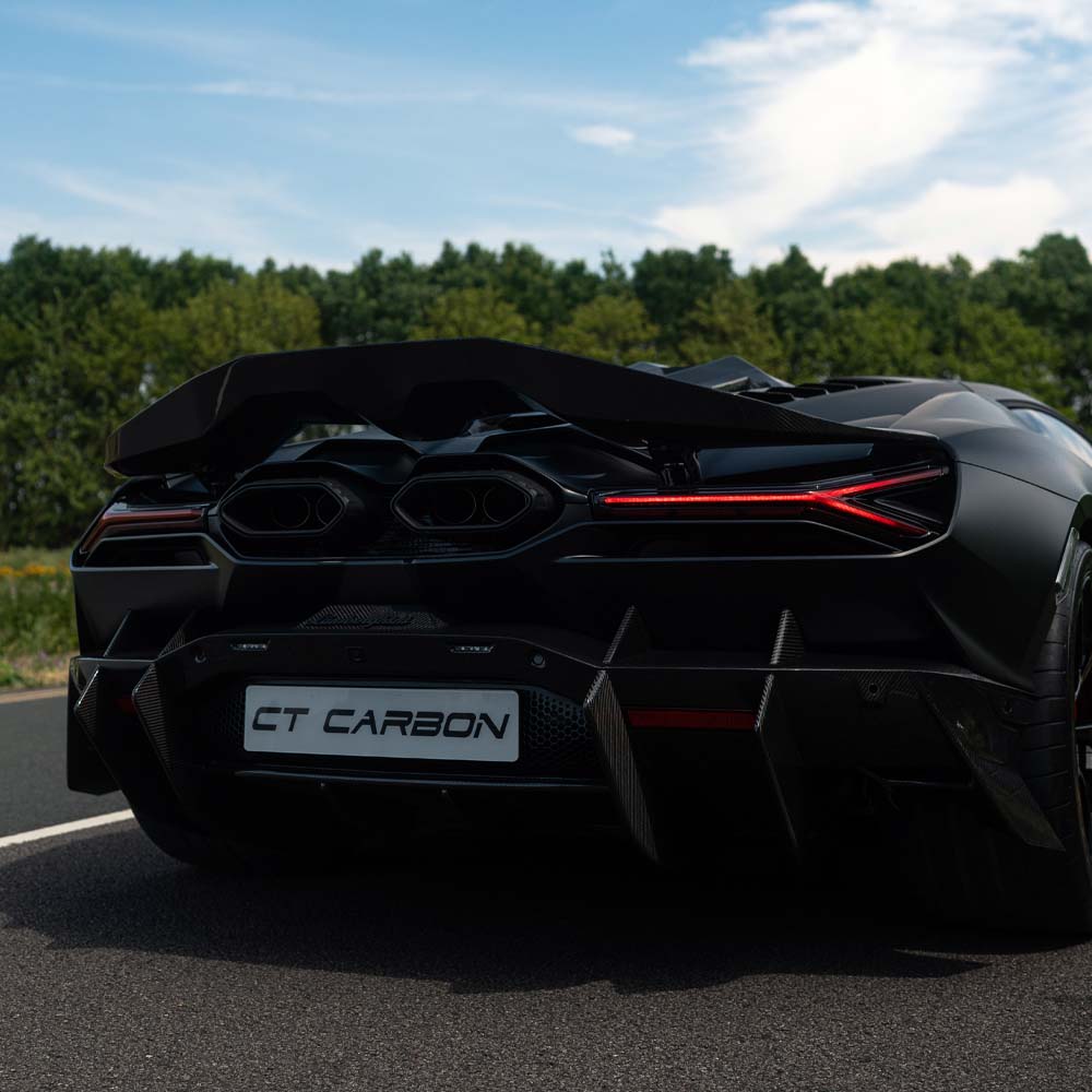 Lamborghini Revueltto carbon fibre rear diffuser by CT Carbon with aerodynamic design and textured carbon fiber surface.
