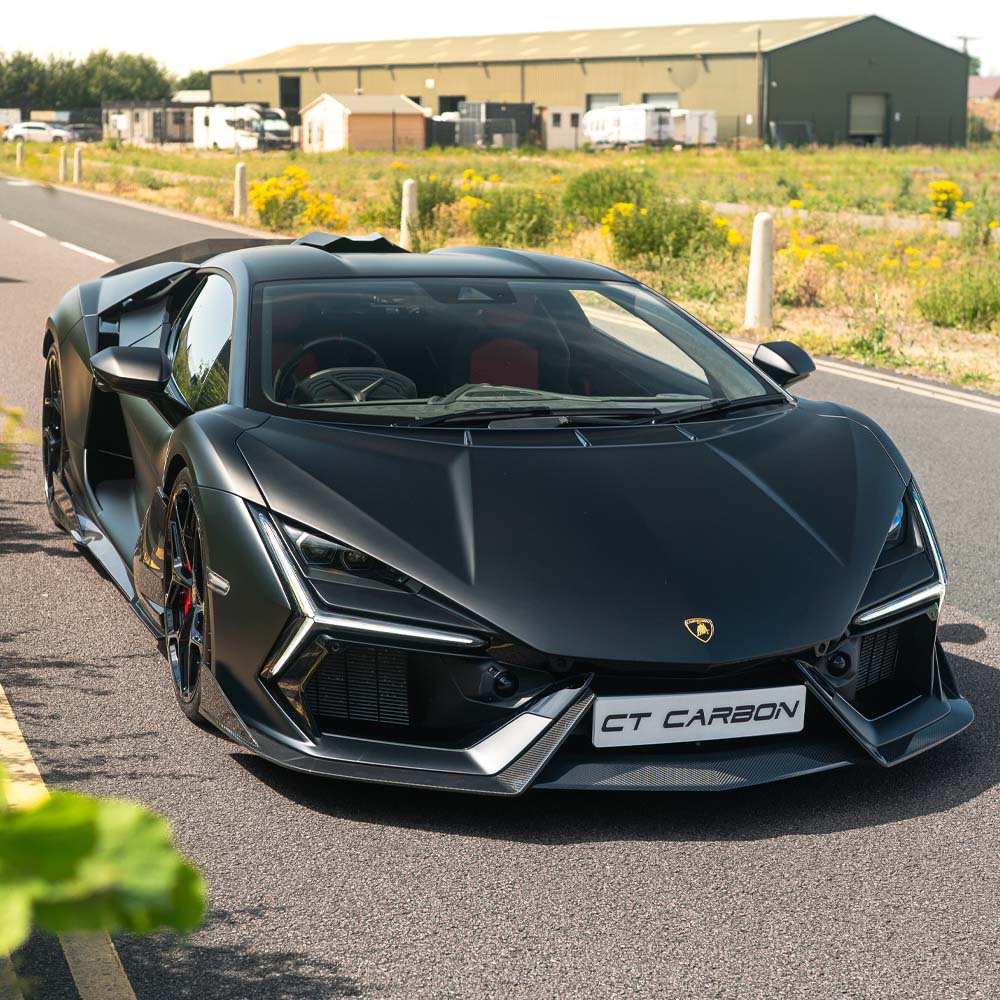CT Carbon Lamborghini Revueltto front splitter made of carbon fiber, showing its sleek aerodynamic design and detailed construction.