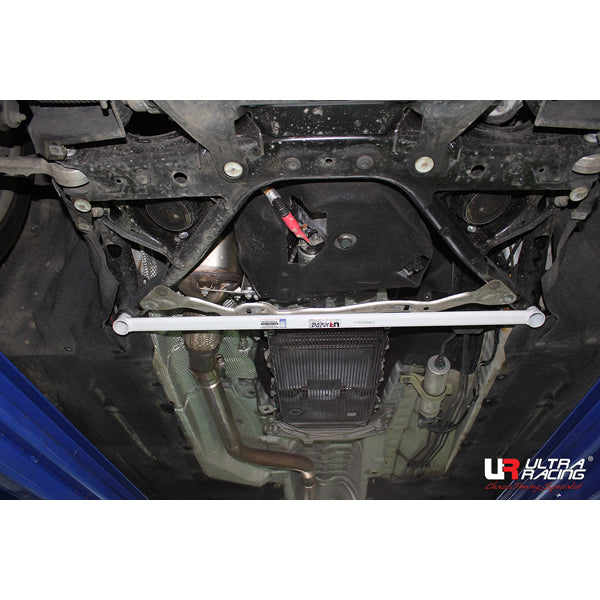 Ultra Racing BMW 1 Series F20 front lower brace strut bar installed on vehicle for improved chassis stability and handling.