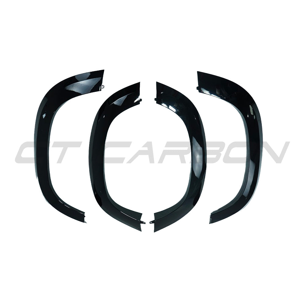 Gloss black wide arch fenders for Land Rover Defender L663 90 by CT Carbon, showcasing sleek, durable accessory design.