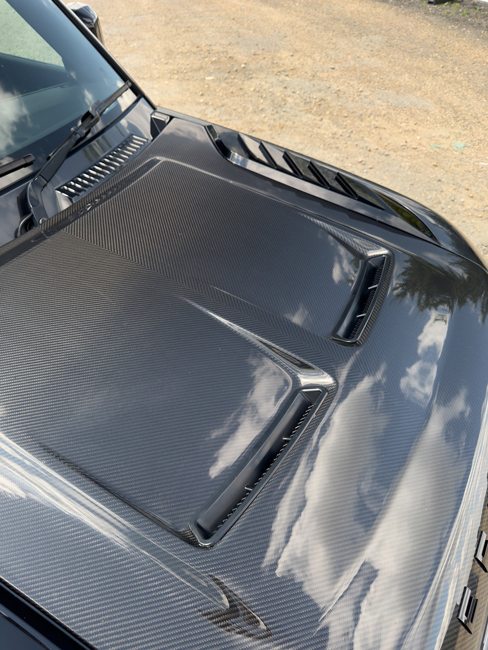 Carbon fiber Land Rover Defender L663 bonnet with SV style design, featuring a sleek, lightweight performance upgrade.