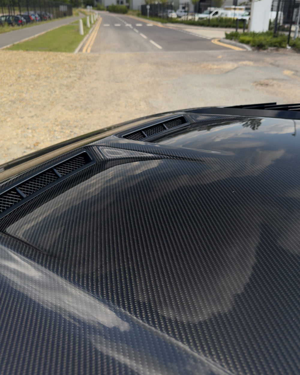 Carbon fiber Land Rover Defender L663 bonnet with SV style design, featuring a sleek, lightweight aesthetic for off-road vehicles.