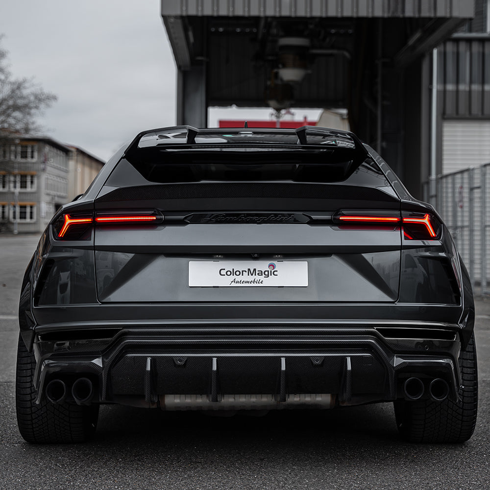 Lamborghini Urus carbon fibre boot spoiler by CT Carbon, showcasing sleek, aerodynamic design on a luxury SUV.