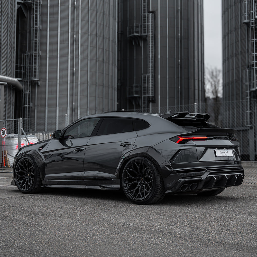 Lamborghini Urus carbon fibre boot spoiler by CT Carbon, shown on the vehicle's rear with sleek, aerodynamic design.
