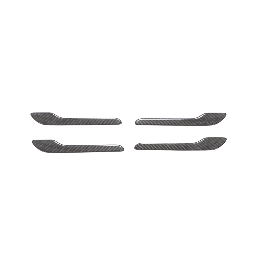 Tesla Model 3 and Y 2017+ carbon fiber handle covers by CT Carbon, close-up of sleek black textured automotive accessory.