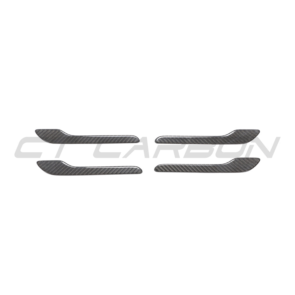 Carbon fiber handle covers for Tesla Model 3 and Y 2017+ by CT Carbon, showing close-up of sleek, textured handles on the vehicle.
