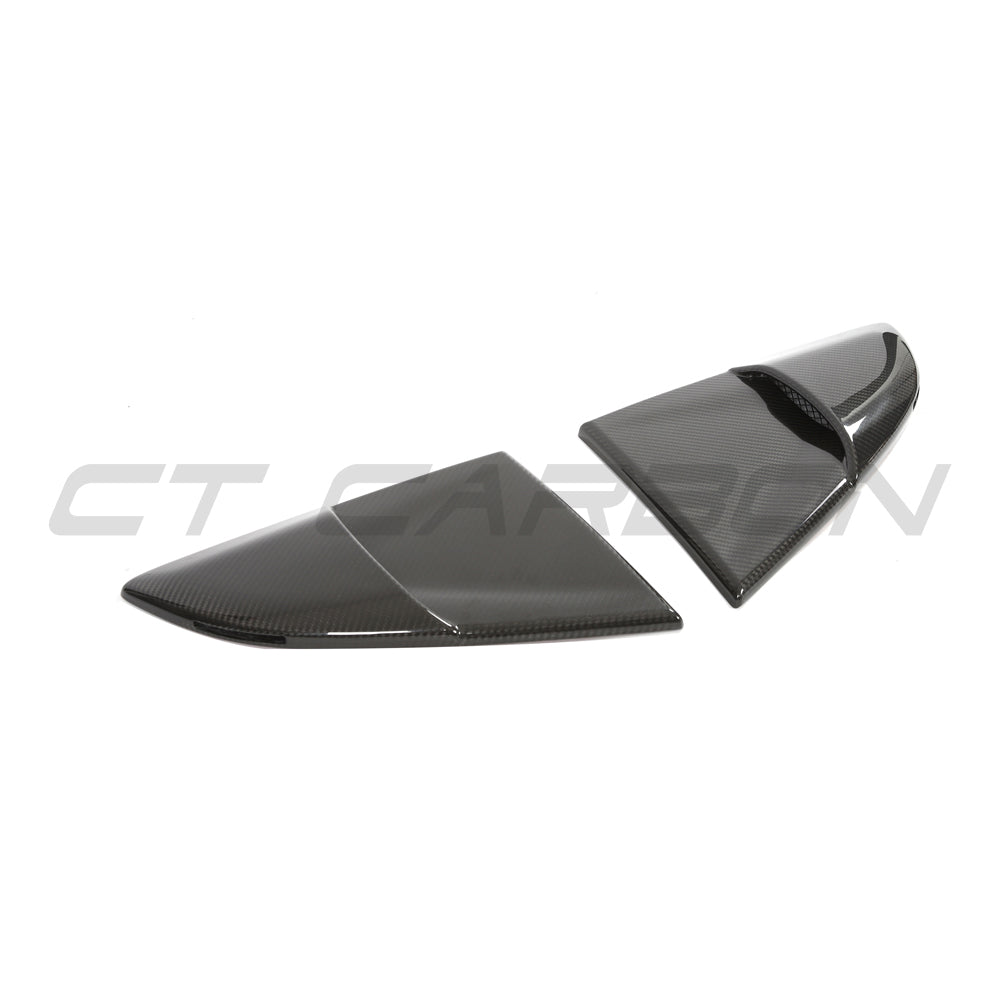 CT Carbon Porsche 718 Cayman 2016+ carbon fiber rear window cover accessory, showing the sleek, textured material on the car window.