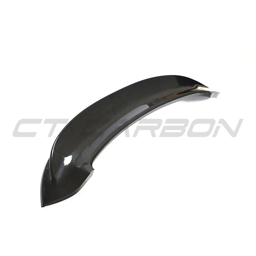 CT Carbon Porsche 992 Carrera GTS 2018+ carbon fiber replacement ducktail spoiler installed on rear of black sports car