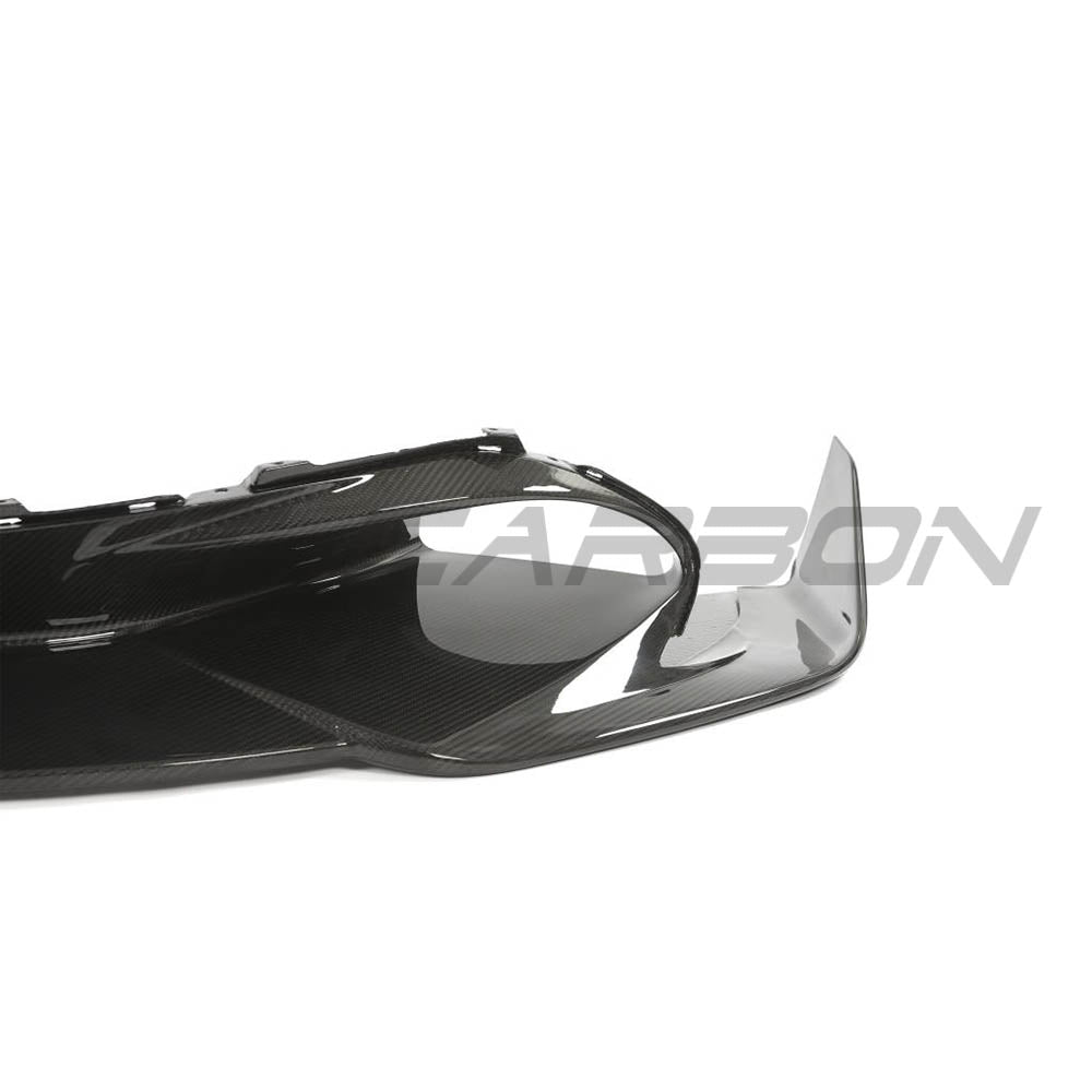 Carbon fiber splitter for McLaren 720S by CT Carbon, showing sleek, aerodynamic design and detailed fiber weave.