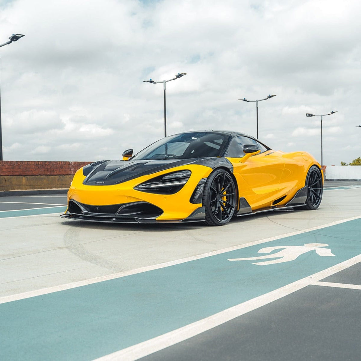 Full view of a McLaren 720S with CT Carbon's V2 full carbon fiber kit installed, showcasing sleek, high-performance car enhancements.