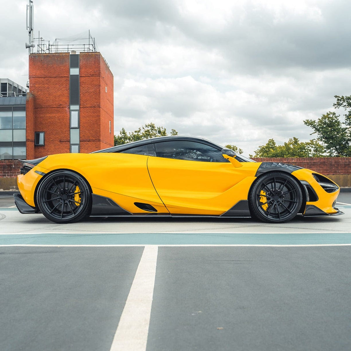 Full view of a McLaren 720S with CT Design V2 full carbon fiber kit, showcasing the sleek, lightweight carbon exterior enhancements.