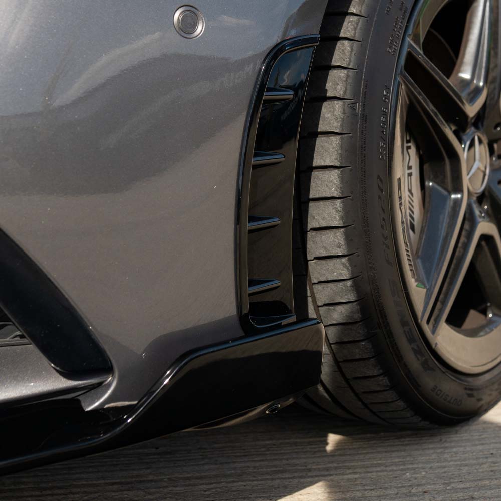 Mercedes A-Class W177 2018-2022 CT Carbon gloss black front bumper vents for enhanced sporty appearance and aerodynamics.