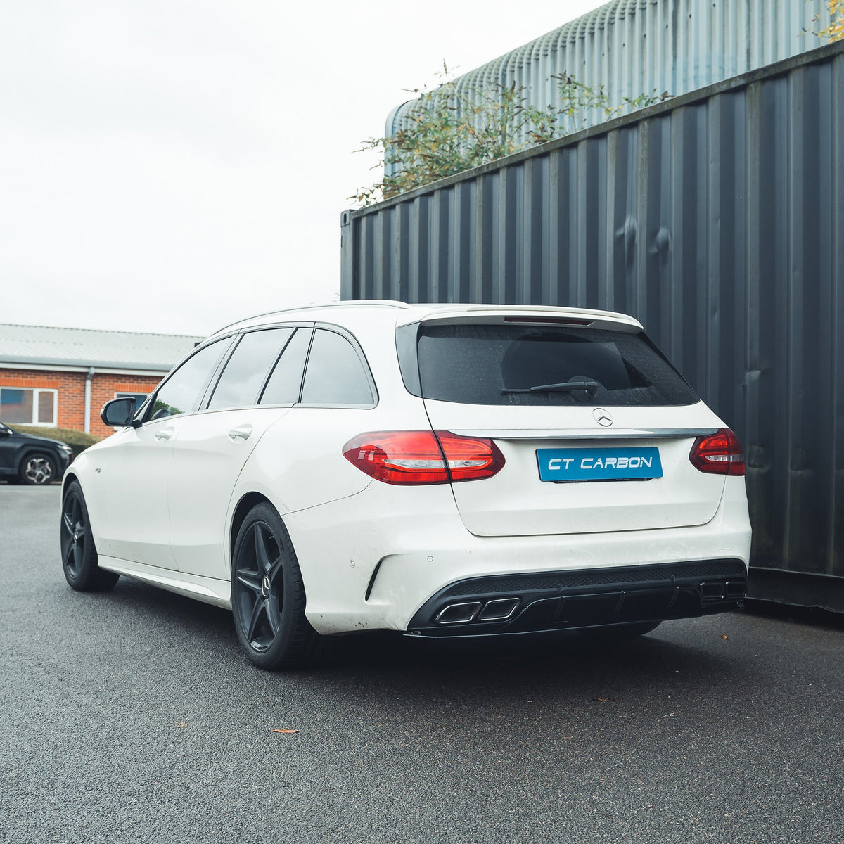Mercedes C-Class W205 saloon estate gloss black diffuser with black tips by CT Carbon, showing the sleek rear bumper detail.