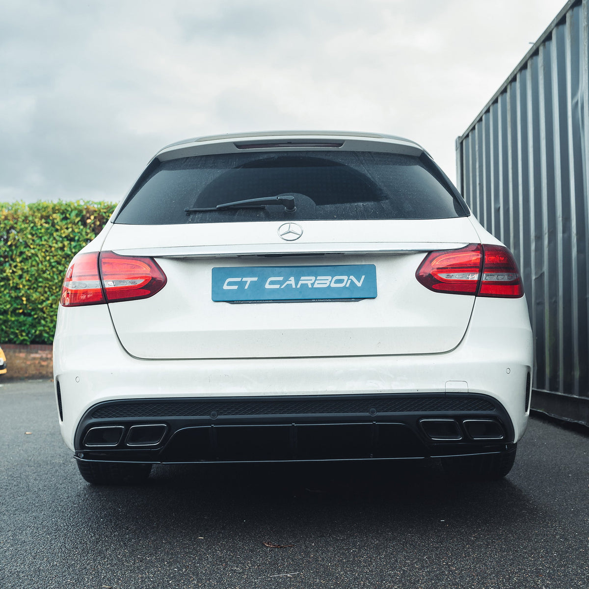 Mercedes C-Class W205 saloon and estate gloss black diffuser with black tips by CT Carbon, showing the sleek rear design.