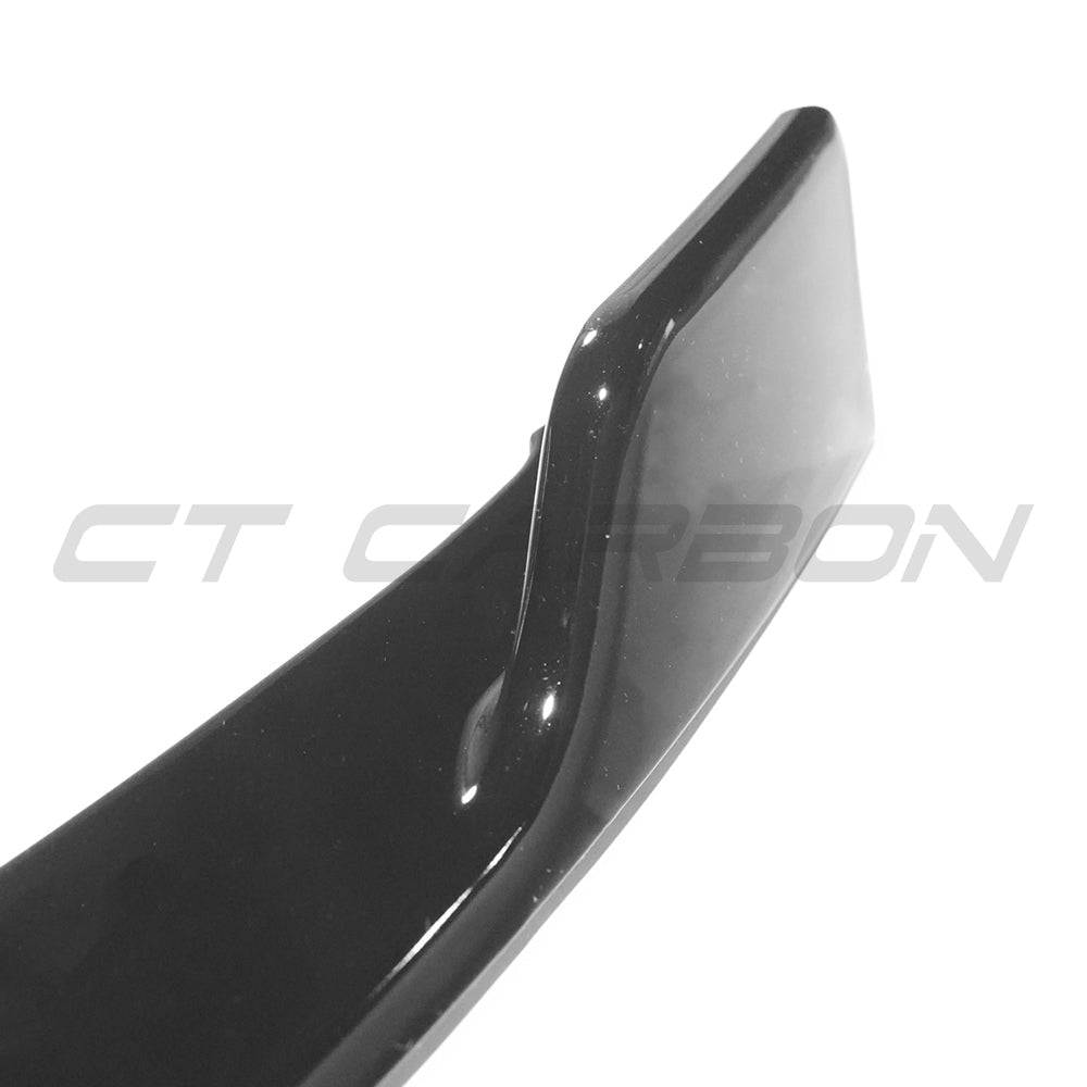 Gloss black Mercedes W118 CLA B Style splitter by CT Carbon, showcasing the sleek aerodynamic design and high-quality finish.
