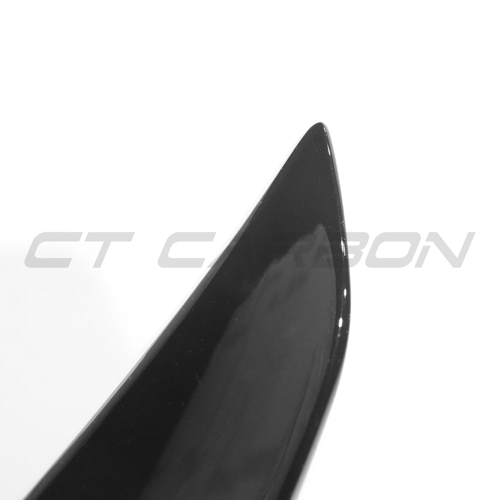 Gloss black Mercedes W118 CLA spoiler by CT Carbon, shown installed on the vehicle, highlighting its sleek aerodynamic design.