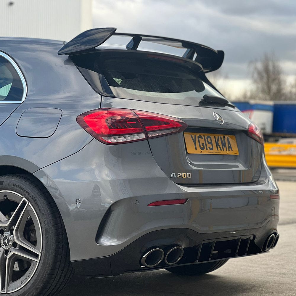 Mercedes W177 A-Class 2018-2022 CT Carbon gloss black kit, including car accessories and trim parts, displayed on the vehicle.