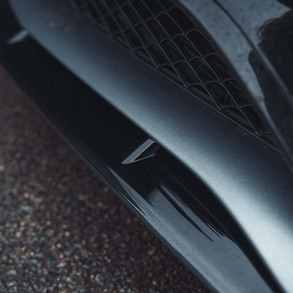 Mercedes W205 C63 Coupe 2015-2018 CT Carbon gloss black splitter installed on front bumper, enhancing sporty look.
