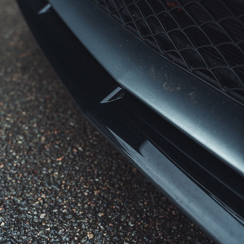 Mercedes W205 C63 Coupe 2015-2018 CT Carbon gloss black splitter installed on front bumper, enhancing sporty appearance.