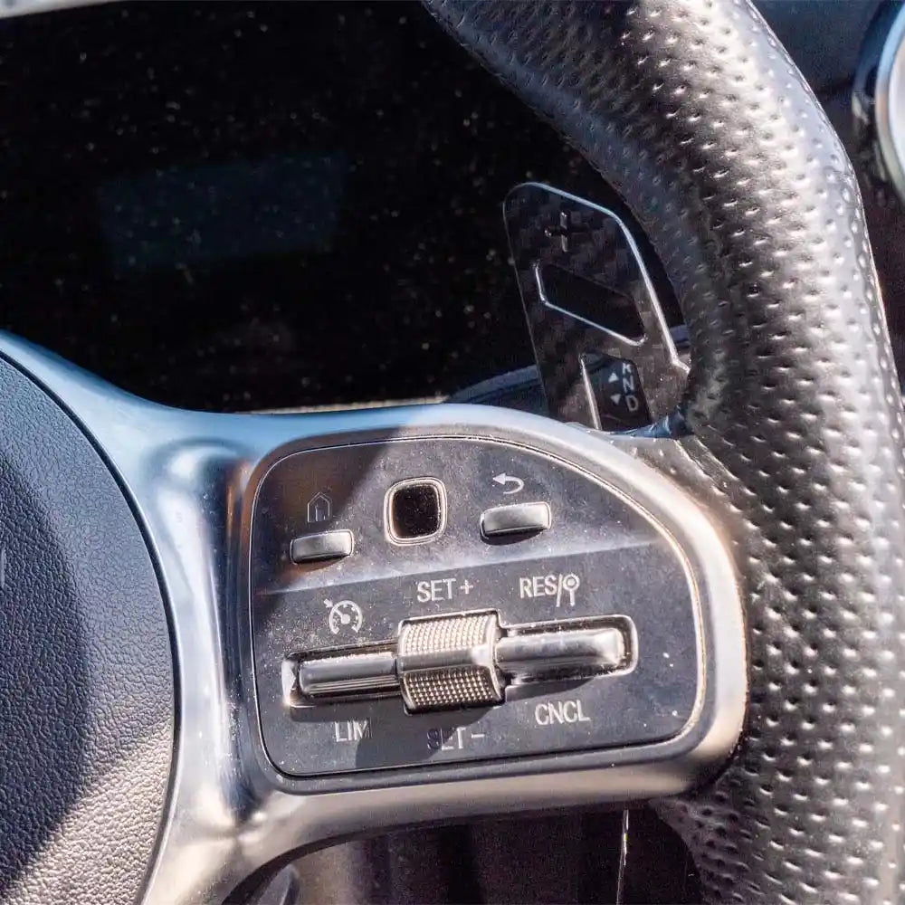 Mercedes AMG magnetic carbon fiber shifter paddles by CT Carbon, featuring sleek black carbon fiber finish for sporty interior accents.