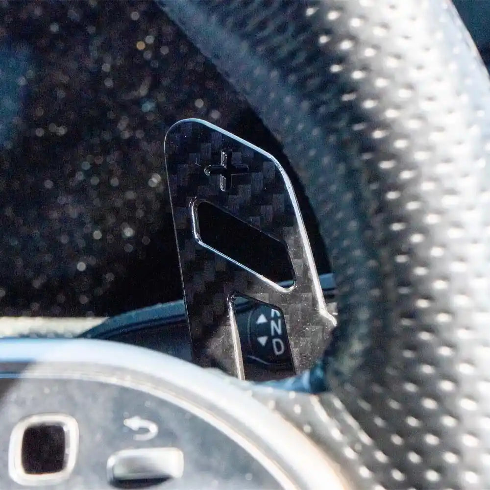 Mercedes AMG magnetic carbon fiber shifter paddles by CT Carbon, featuring sleek black carbon fiber design for AMG vehicle interior.