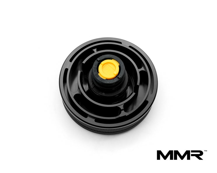 MMX Performance MMR 90mm billet coolant expansion cap for BMW vehicle, with sleek metallic design and branding.