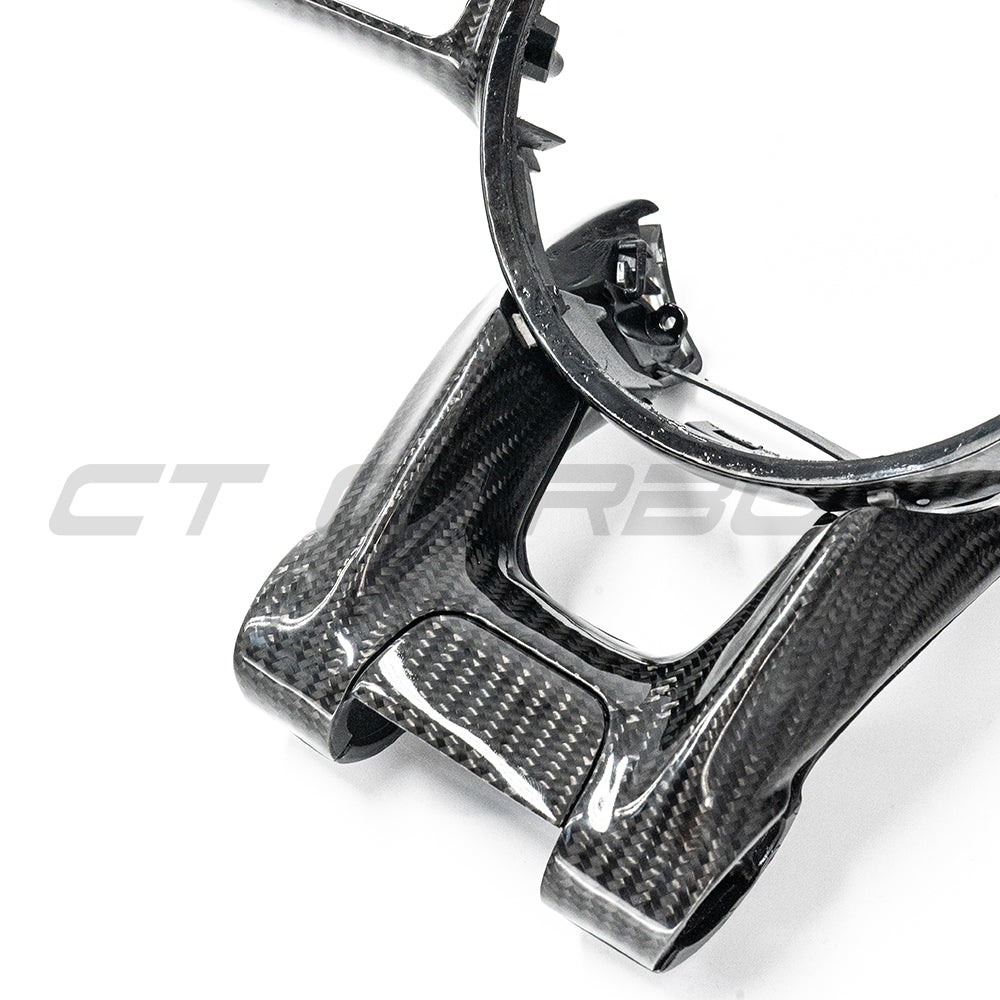 Mercedes AMG 2016+ carbon fiber steering wheel trim accessory by CT Carbon, showing close-up of sleek, glossy finish on steering wheel.